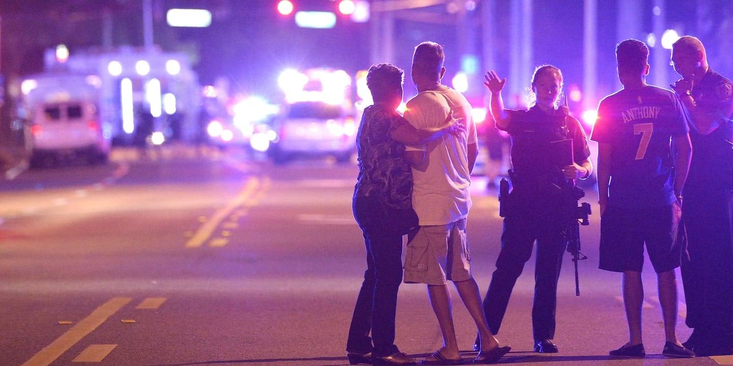 Police direct people away from the scene of the shooting at Pulse nightclub in Orlando, Florida on June 12, 2016. (AP Photo/Phelan Ebenhack)
