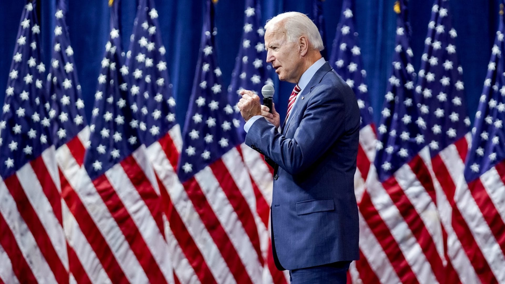 Joe Biden speak in front of American flags at the 2020 Gun Safety Forum. 